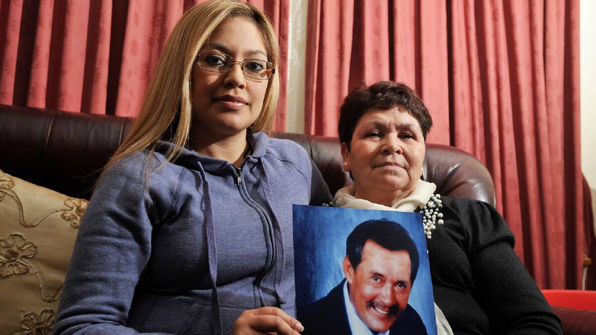 HOLDING HOPE: Maria Vanegas (right) and daughter Gloria Blacka hold a photograph of Rafael Vanegas, who has been missing since November 2002.  Picture: Alastair Brook