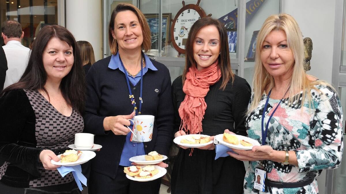 (From left) Kirrily Welsh, Karen Morgan, Clarissa Hewitt and Donna Burton attend a Biggest Morning Tea for Cancer Council at Wagga City Council. Picture: Picture: Michael Frogley